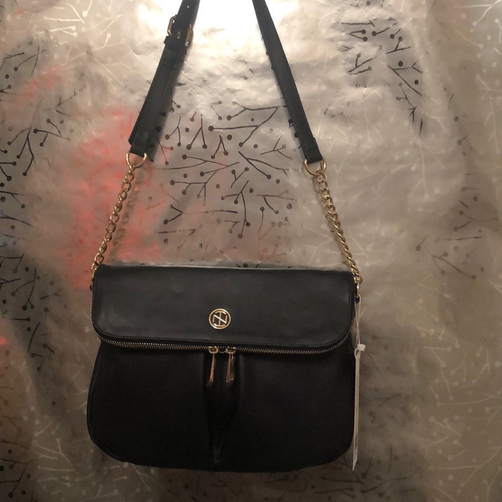 Tracy Negoshian navy cross body purse.